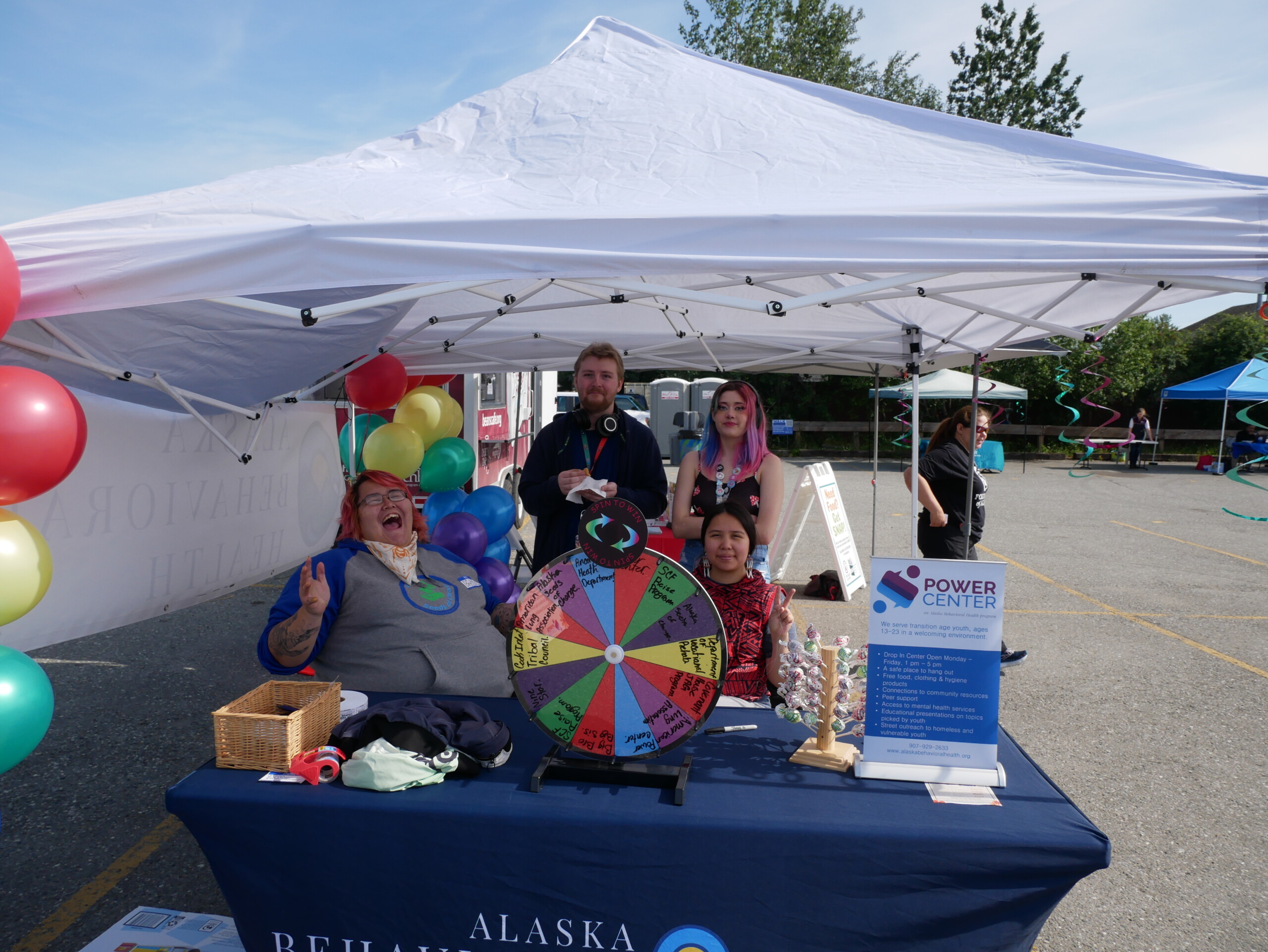 happy people staffing an event tent